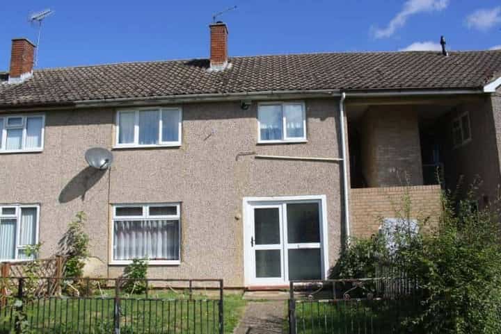 A pebbledashed house, photographed
